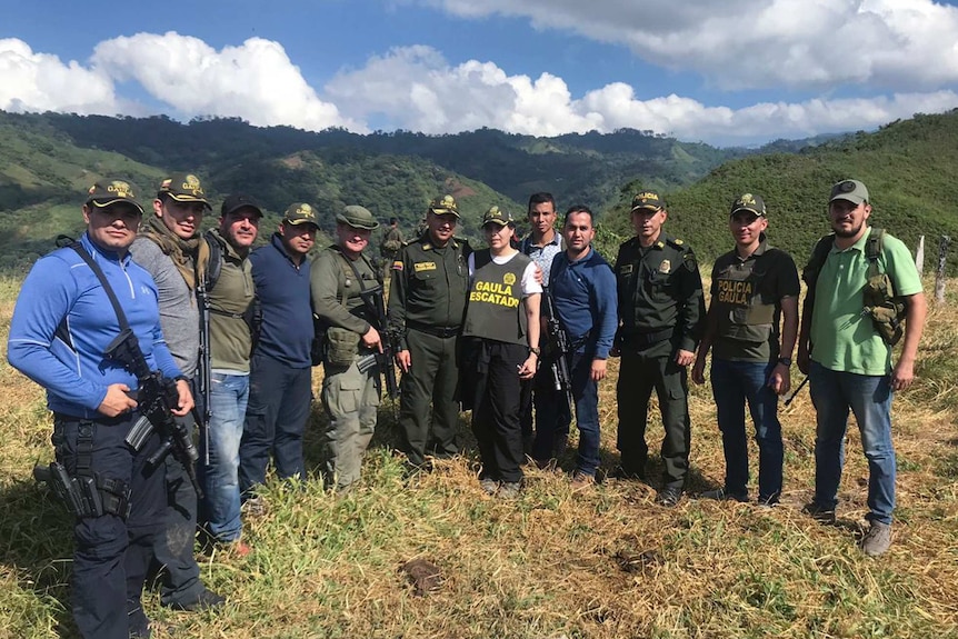 Melissa Martinez Garcia poses with 11 military men who rescued her from kidnappers in rural Colombia.