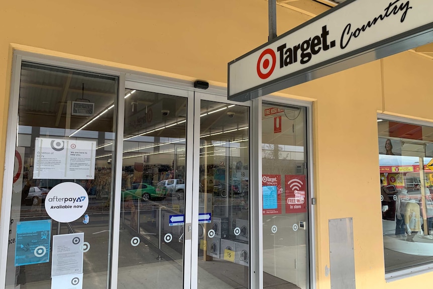 A sign for Target Country sits above the front doors of the store.