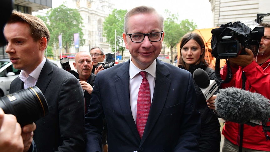 Britain's Justice Minister Michael Gove arrives to address a press conference in central London.