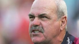 Leigh Matthews looks on as the Lions take on the Swans at Olympic Stadium