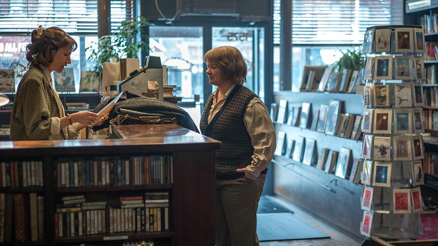 Colour still of Dolly Wells and Melissa McCarthy in bookshop in 2018 film Can You Ever Forgive Me?
