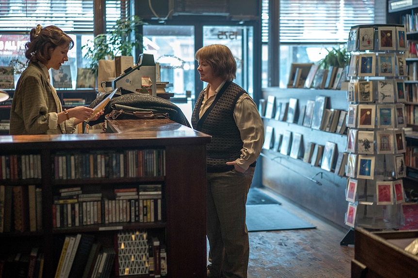 Colour still of Dolly Wells and Melissa McCarthy in bookshop in 2018 film Can You Ever Forgive Me?