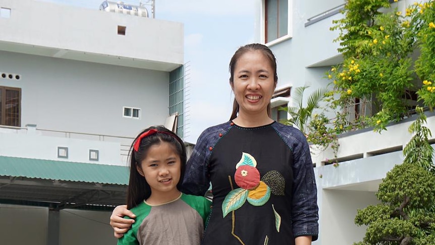 Vietnamese political prisoner Mother Mushroom with her young daughter.