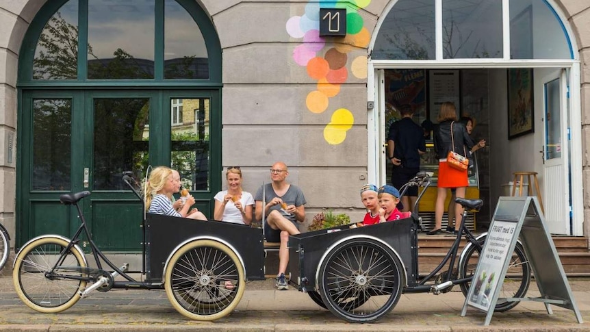 A family enjoys ice cream after cycling in Copenhagen.