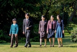 Japan's Prince Akishino and his wife and three children are seen walking in a garden