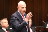 Tasmanian Treasurer Peter Gutwein forges ahead with wage-freeze plan.