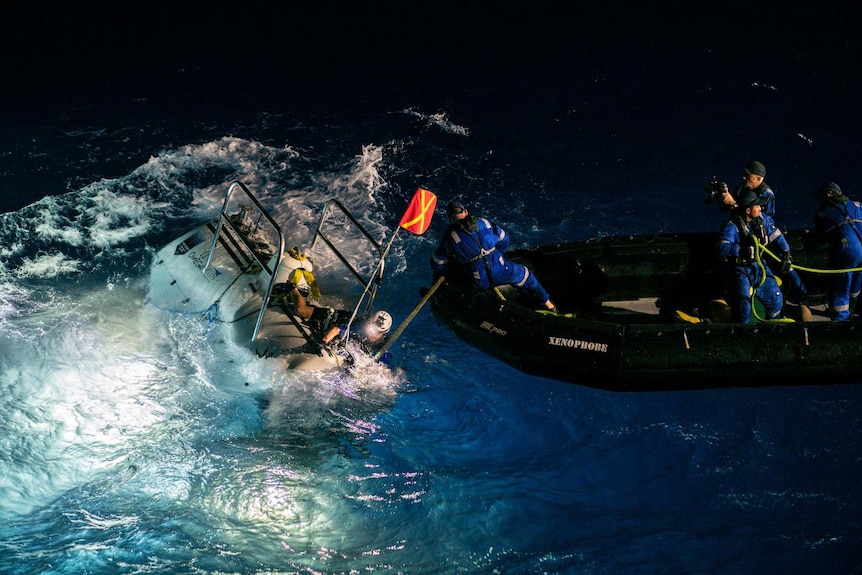 The DSV Limiting Factor submarine is launched over Mariana Trench.