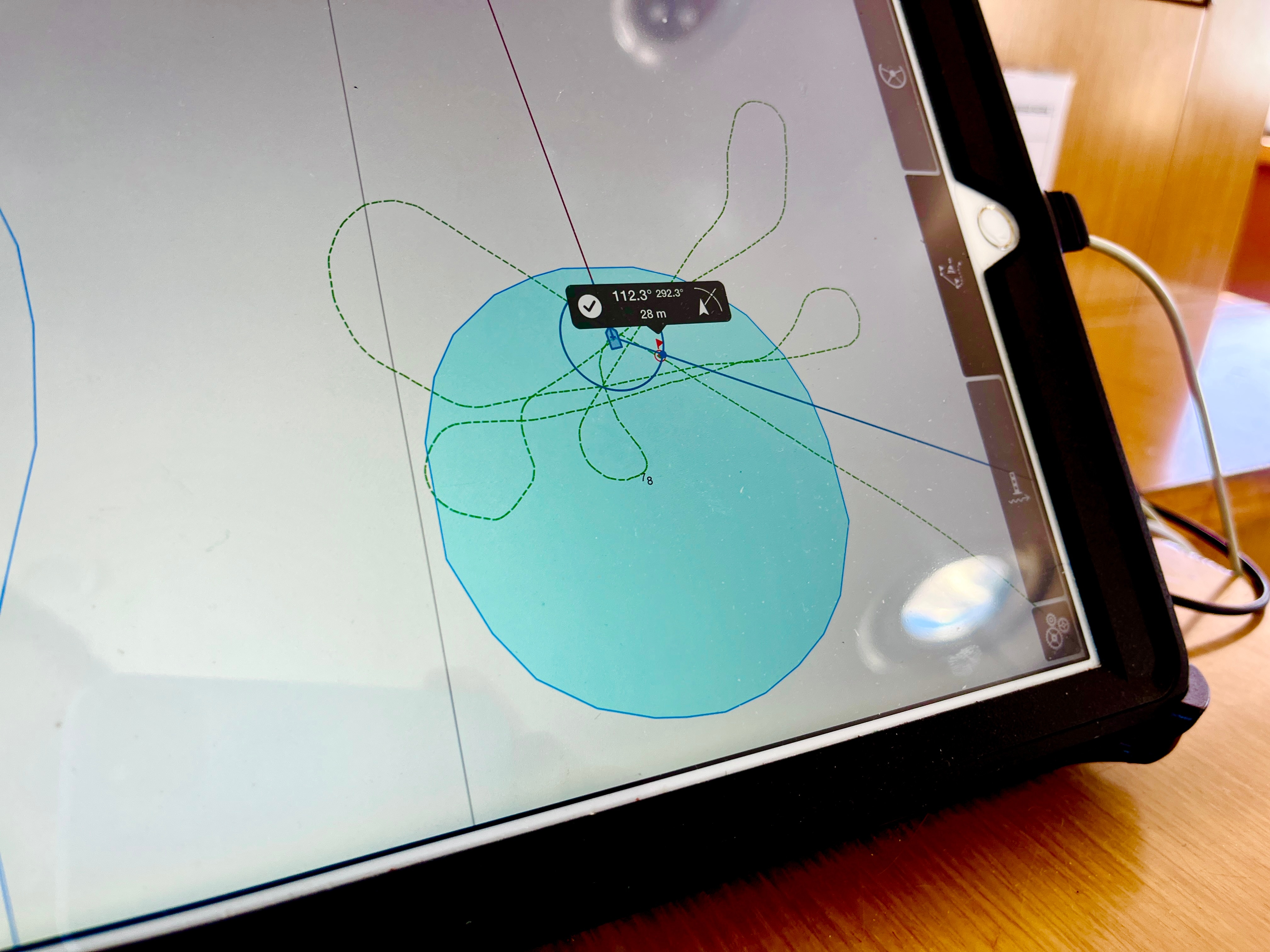 A digital screen shows a series of lines circling over a blue circle.