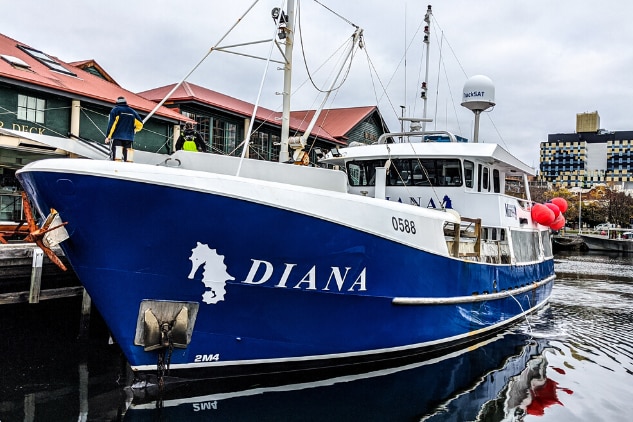 fishing vessel sitting at the dock