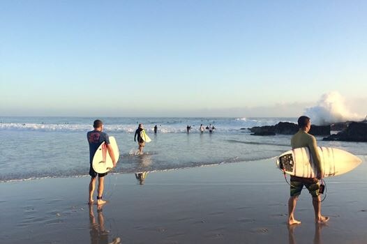 Surfers revelled in the big waves at the famous Snapper Rocks on Friday morning.