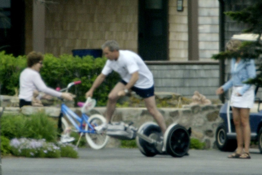 Former US president George Bush falls off a segway