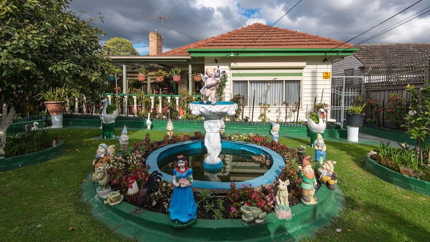Front yard with fountain and gnomes
