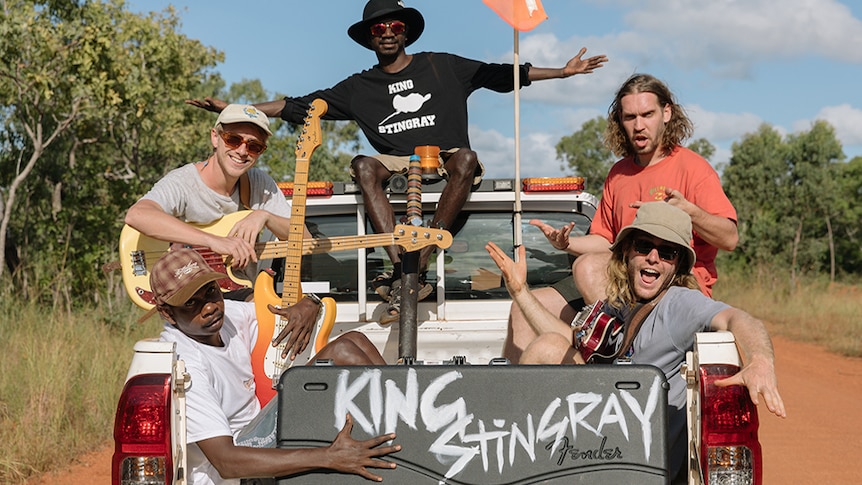 King Stingray bundled into the back of a ute with a road case displaying the band's name