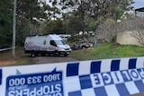 A police exclusion zone following a fatal house fire on Russell Island