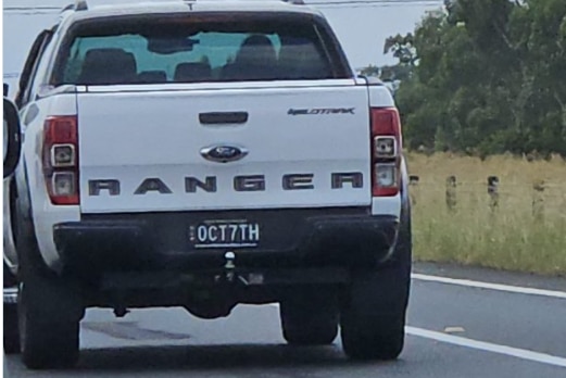 the back of a white ute with oct7th number plate