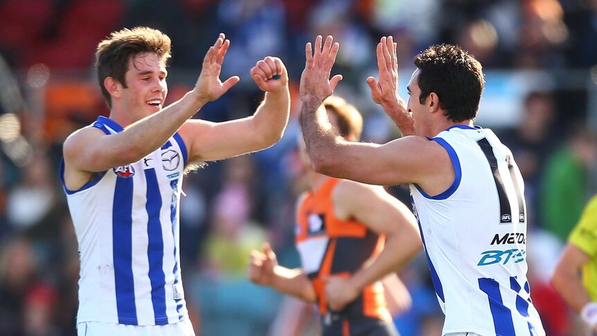 Michael Firrito celebrates a Noth Melbourne goal