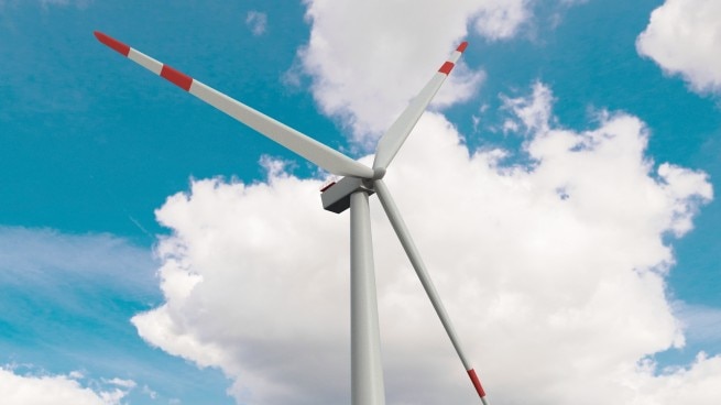 Wind turbines operating offshore.