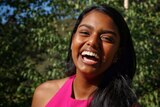 Close up of Veena Wijewickrema laughing.