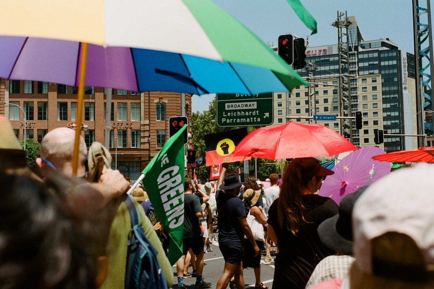 A person hold a black pride sign during the 2019 Yabun Festival march through Sydney.