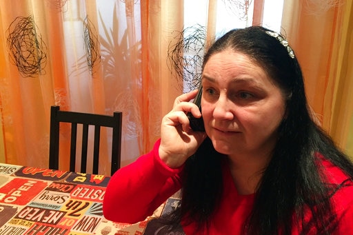 Khalid Masood's neighbour, Iwona Romek speaking on a phone in her kitchen