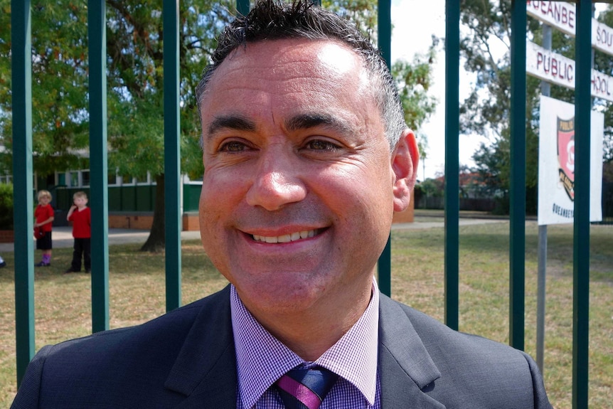 NSW Nationals MP for Monaro John Barilaro smiles outside Queanbeyan South Primary School during NSW election campaign. 10 March 2015
