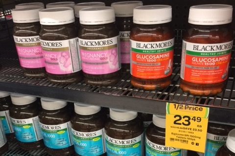 Blackmores vitamin pill bottles on shelf