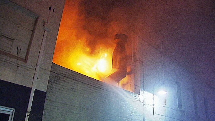 Flames leap from the roof of a Chinatown restaurant in Melbourne's CBD.