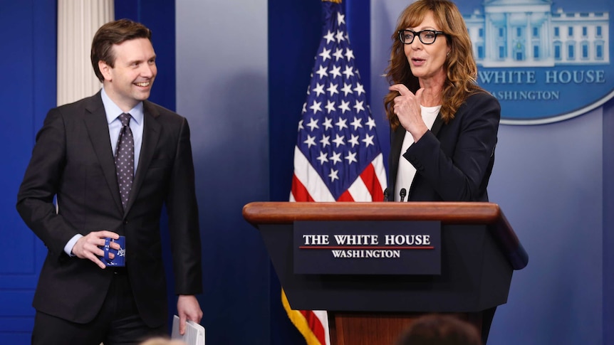 Press Secretary Josh Earnest and Allison Janney at the podium