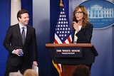 Press Secretary Josh Earnest and Allison Janney at the podium