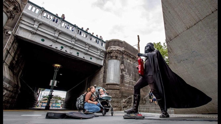 A picture of Base Vader busking outside Arts Centre Melbourne