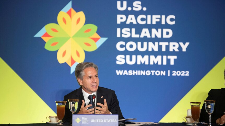 Antony Blinken gives speech in front of signage for the US-Pacific Country Summit. 