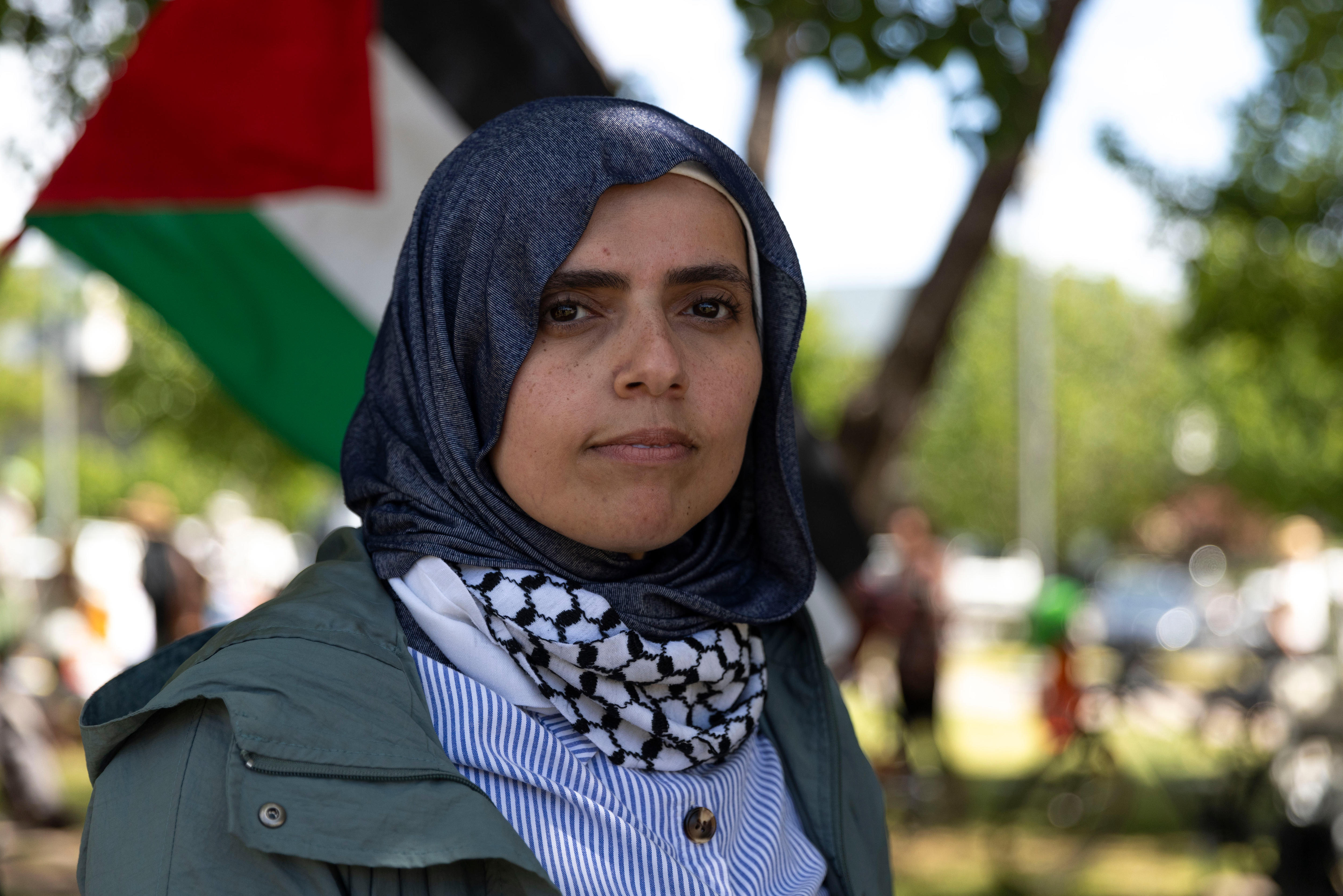 Eurobodalla resident and Palestinian-Australian Aroub Lahham with a Palestinian flag flying behind her