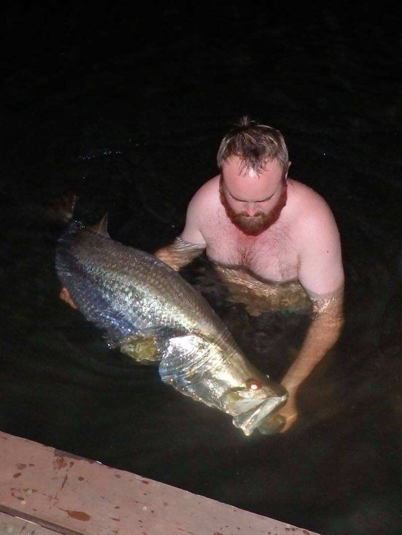 The lucky angler with one of the large barramundi caught at Lake Bennett, NT.