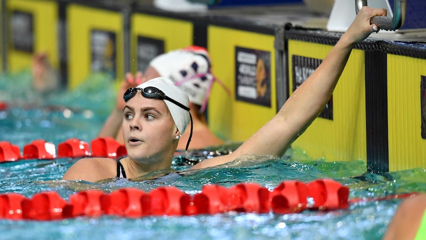 Shayna Jack looks over her shoulder after completing a race in the pool