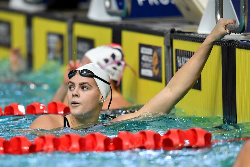 Shayna Jack looks over her shoulder after completing a race in the pool