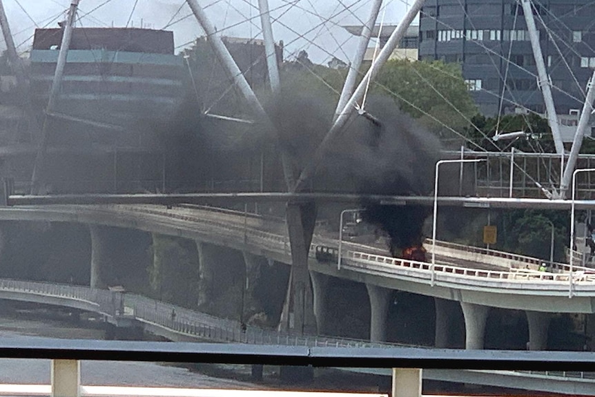 A cloud of black smoke rising from a burning car on Brisbane's Riverside Expressway