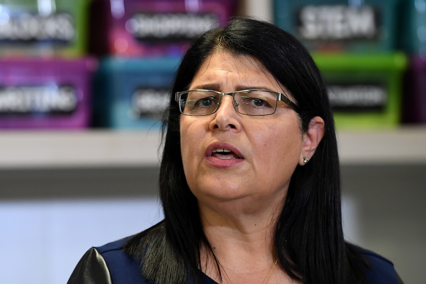 A woman speaks during a press conference in Brisbane.