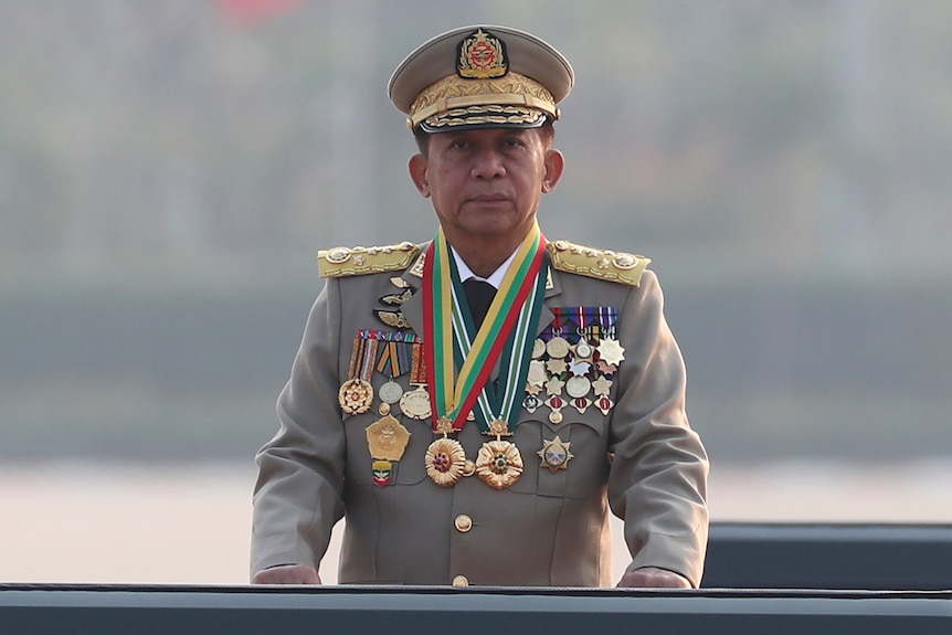 General wearing military uniform and series of medals.