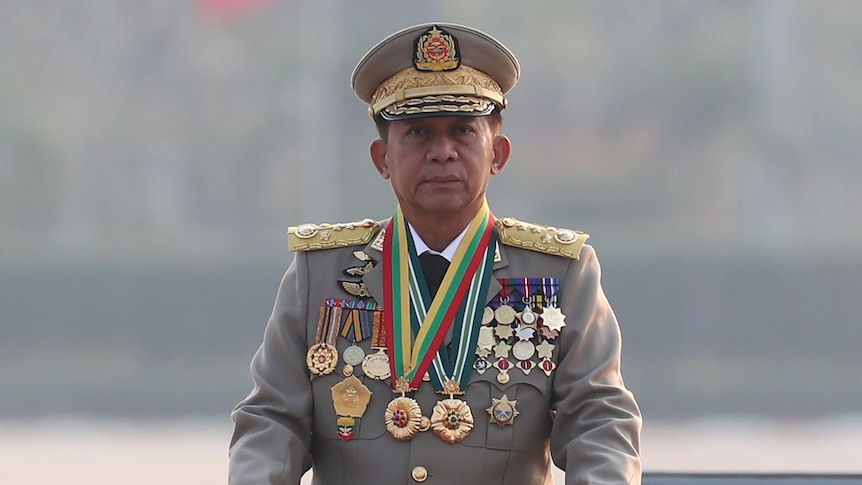 General wearing military uniform and series of medals.