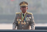 General wearing military uniform and series of medals.