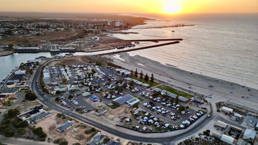 A drone picture showing the top of the Wallaroo Holiday Park with the ocean in the background. 