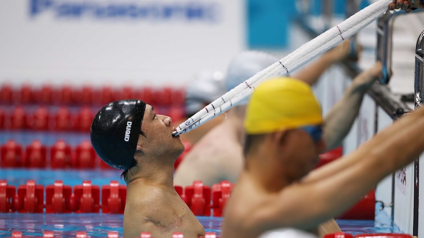 China's He Junquan prepares to compete in the men's 50m backstroke S5 at the London Paralympics.