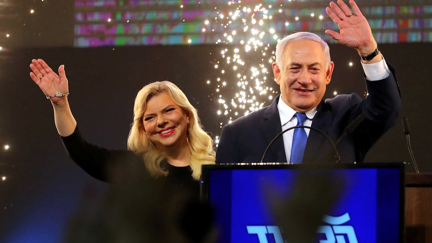 Israeli Prime Minister Benjamin Netanyahu and his wife Sara wave.