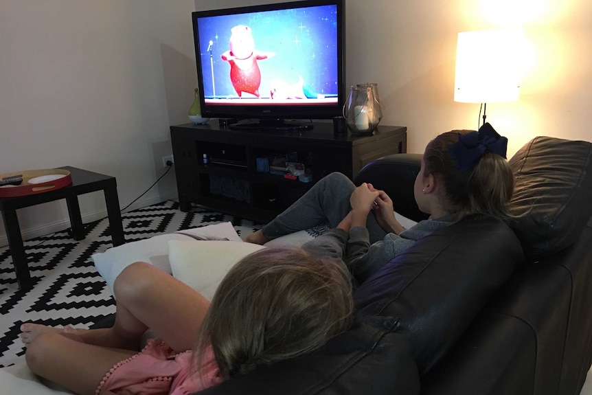 Children watching movies on stormy day