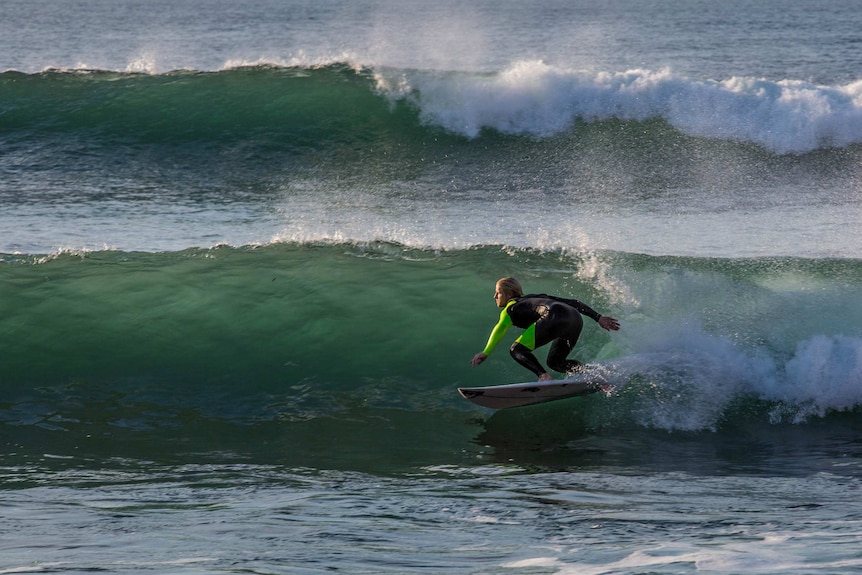 Surfer Cody Robinson rides a wave at Bells Beach.
