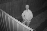 A man caught on CCTV footage just before he threw an item believed to be baited meat over a backyard fence in Canberra's north.