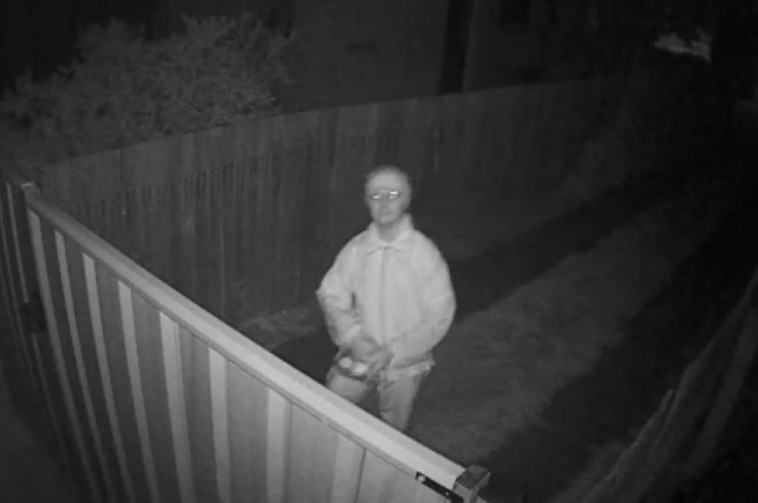 A man caught on CCTV footage just before he threw an item believed to be baited meat over a backyard fence in Canberra's north.