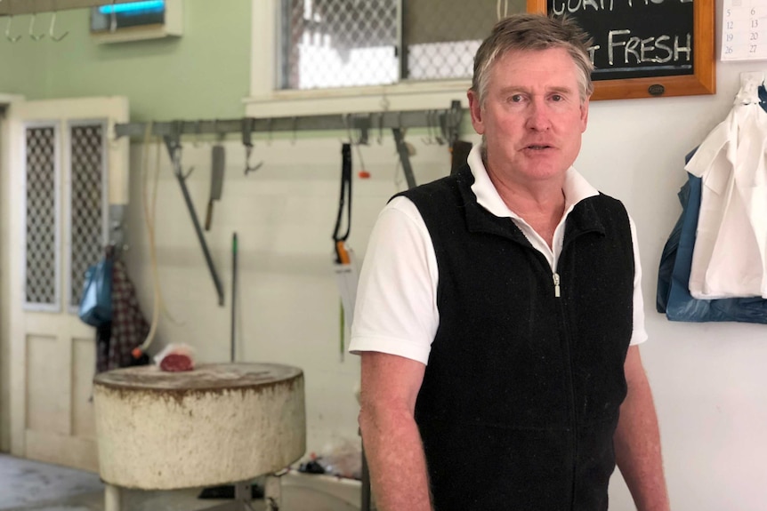 Gary Purser stands in his butcher shop.