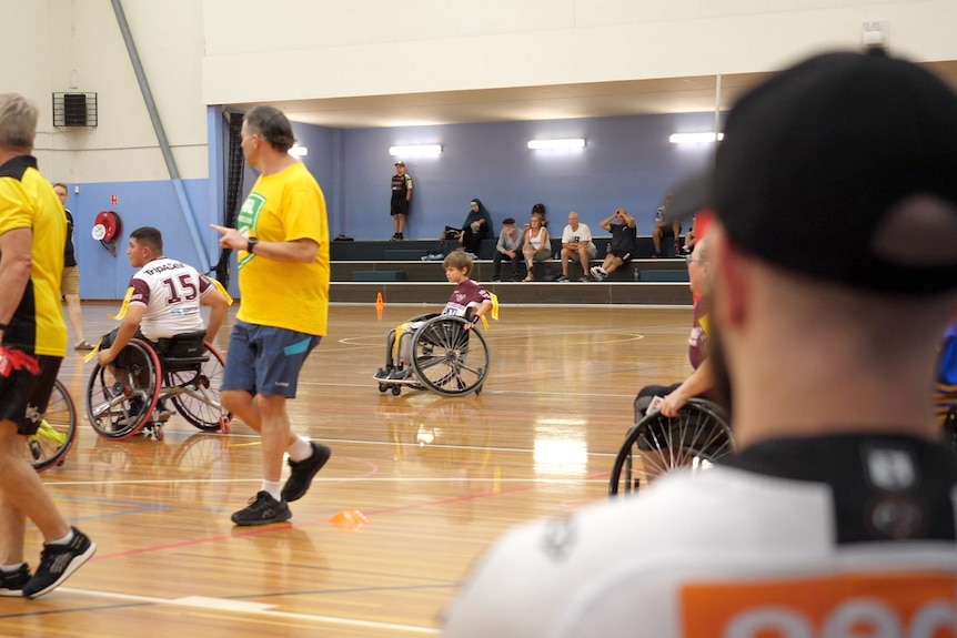 Child in wheelchair on basketball court