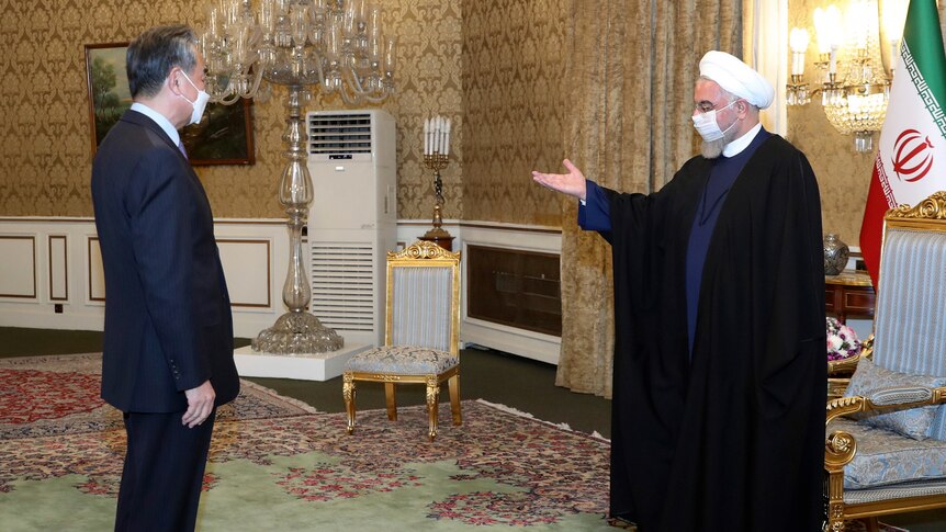  President Hassan Rouhani, right, welcomes Chinese Foreign Minister Wang Yi.